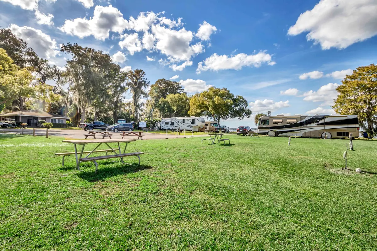 Open lawn and picnic table at Hide-A-Way Harbor